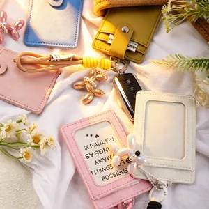 Detailed view of colorful ID card holders with balloon dog charms and elegant braided ropes.
