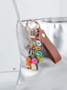 Portachiavi insegnante con lettere acriliche e cinturino in pelle PU su borsa argento