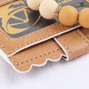 Close-up of scalloped leather card holder with silicone beads and rhinestone spacer