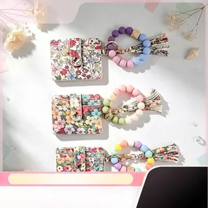 Porte-cartes Imprimé Floral pour Femmes Avec Bracelet en Perles de Silicone Coloré Porte-clés Pompon Monnayeur à Fermeture Éclair