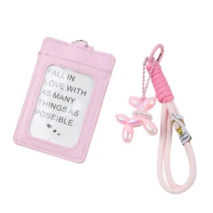 Detail view showing pink PU leather ID card holder and balloon dog lanyard keychain set