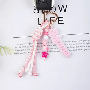 Elegant pink woven rope keychain with Mama letter charm and heart-shaped metal clip