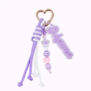 Handmade purple braided rope keychain with Mama acrylic charm and rose gold heart clasp