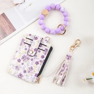 Floral print ID card holder set with purple silicone bead bracelet and matching tassel keychain