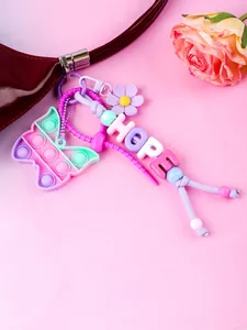 Detail showing a colorful butterfly pop-it charm with HOPE letter beads and flower.
