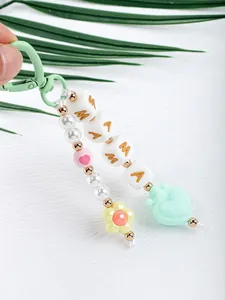 Close-up of cute silicone beaded keychain with MAMA letter beads and heart charm