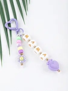 Detailed view of colorful silicone beaded keychain featuring MAMA letters and a purple heart