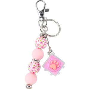 Portachiavi in perline di silicone rosa con fiori di ciliegio e ciondolo zampa di gatto