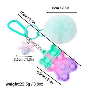 Colorful pom pom bear fidget toy keychain showing exact product dimensions and weight
