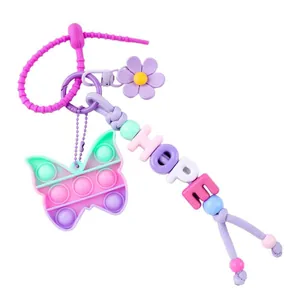 Handmade colorful beaded keychain with butterfly pop-it fidget toy and flower charm