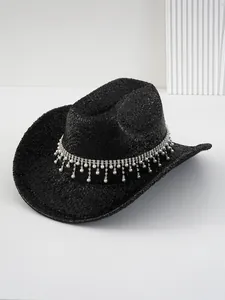 Close-up of black glitter cowboy hat with rhinestone and pearl tassel band