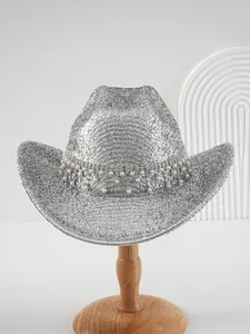 Detail view of silver glitter cowboy hat with luxury rhinestone and pearl fringe trim