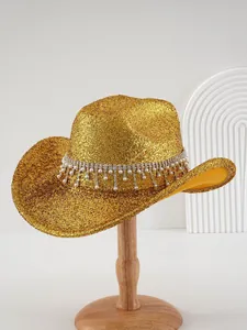 Luxury gold glitter fedora hat with rhinestones and pearl fringe on a wooden stand