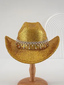 Detailed view of luxury gold glitter cowboy hat with rhinestone and pearl tassel band