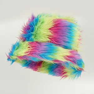Detailed view of the vibrant rainbow faux fur texture on a winter bucket hat