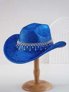 Close-up of a luxurious blue glitter cowboy hat featuring rhinestones and pearl pendants