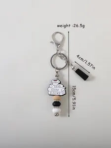 Detailed view of silicone keychain with beads and 'Read Good Books' charm