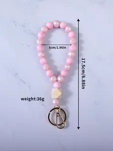 Misure dettagliate del cinturino portachiavi in perline di silicone rosa confetto.