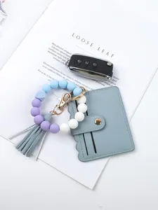 Blue PU card holder with purple and blue silicone beaded bracelet keychain set