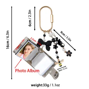 Detail view of mini keychain photo album with measurements and weight specifications
