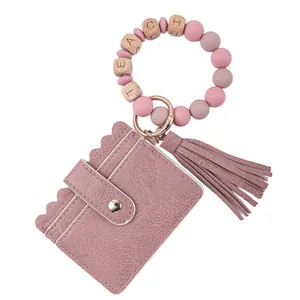 Pink PU leather card holder wristlet keychain with tassel and 'TEACH' wooden beads decor