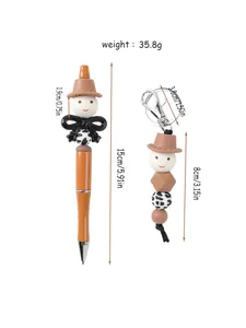 Detail view of cartoon beaded ballpoint pen and keychain set with dimension labels