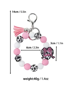 Vista detallada de las dimensiones del llavero de pulsera de silicona rosa y blanca con MAMA