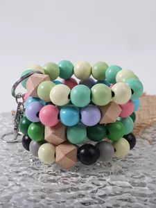 Detailed view of colorful wooden bead bracelets with geometric beads and metal clasps