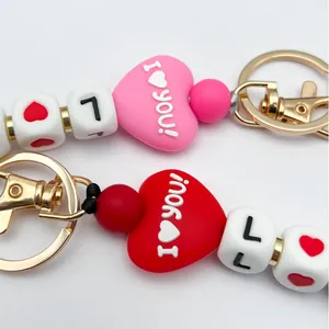 Silikonperlen Schlüsselanhänger mit 'I Love You' Herz und Goldclip in Rot und Pink