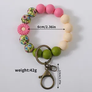 Colorful daisy silicone bead wristlet keychain with dimensions and weight data shown