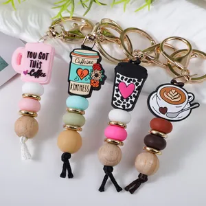 Handmade wooden and silicone bead keychains with coffee cup charms and lobster clasps
