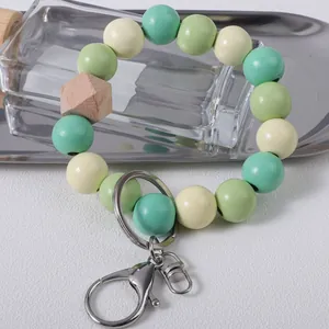 Pastel green wooden bead wristlet keychain holder with silver metal lobster clasp