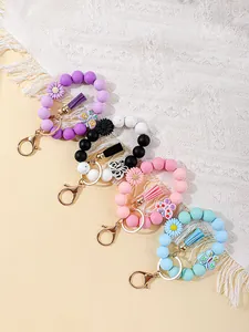 Colorful silicone bead wristlet keychains with floral charms and stylish tassels