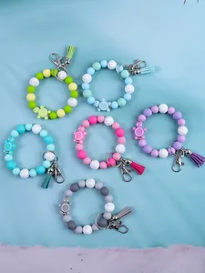 Set of six colorful silicone bead wristlet keychains with tassels and turtle charms