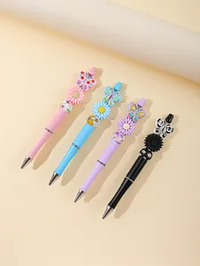 Four colorful beaded ballpoint pens with decorative butterfly and flower acrylic beads
