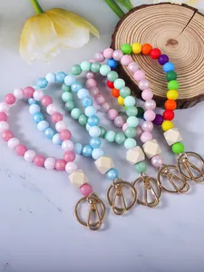 Portachiavi da polso in perle di silicone colorate con dettagli in legno