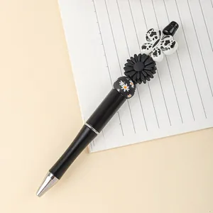 Creative acrylic beadable ballpoint pen with butterfly and flower beads, 1.0mm tip.