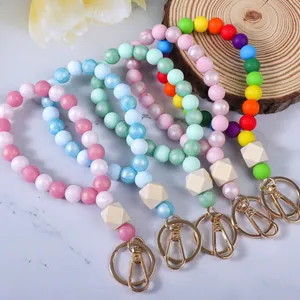 Braccialetti portachiavi in perle di silicone colorate con chiusure dorate in metallo