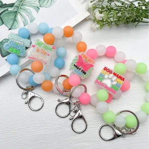Pulsera llavero de cuentas de silicona luminosa con varios colgantes decorativos
