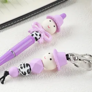 Cute purple cartoon beaded ballpoint pen and matching keychain set with silicone beads