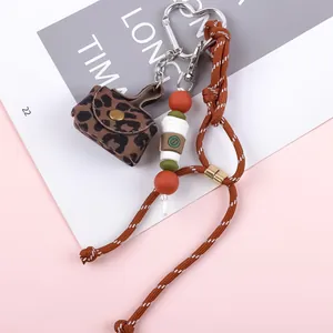 Cute leopard print leather purse keychain with coffee cup charm and braided rope