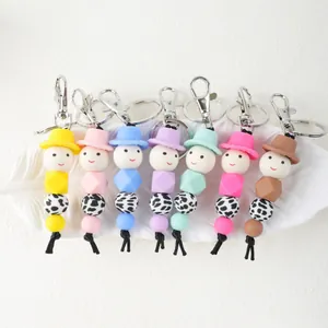 Set of colorful cartoon silicone bead keychains featuring cute smiley face characters.