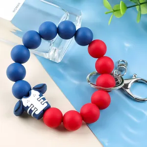 Red and blue silicone bead keychain featuring a football jersey charm and metal clasp