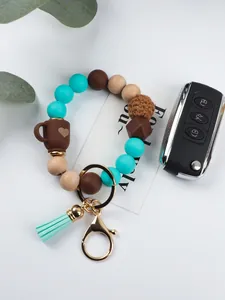 Detailed view of elastic silicone bead keychain with wooden beads and coffee cup charm