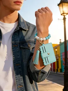Detail view of light blue PU leather card holder with silicone bead bracelet on wrist