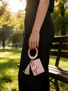 Pink PU leather wristlet card holder with silicone beads and decorative tassel