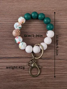 Detail view of floral silicone beaded wristlet keychain with dimensions and weight