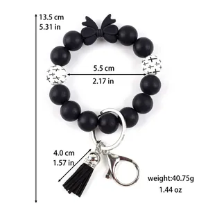 Siliconen kralen sleutelhanger armband met strik en kwastje met productafmetingen