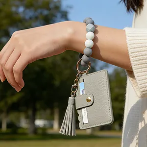 Silicone bead wristlet keychain with gray PU leather card holder and tassel detail