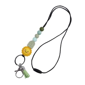 Handmade silicone beaded lanyard with cute sun charm and green tassel for bag or keys